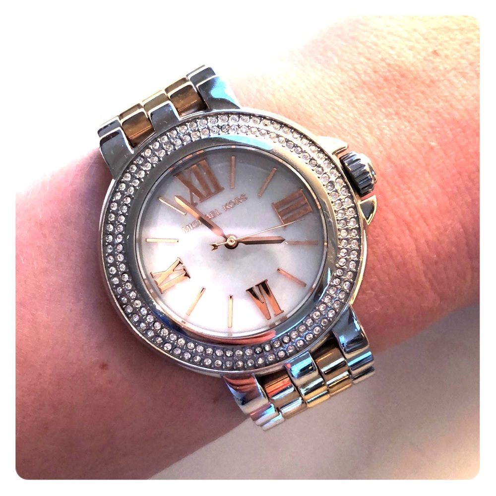 Silver and gold metal Michael Kors watch.